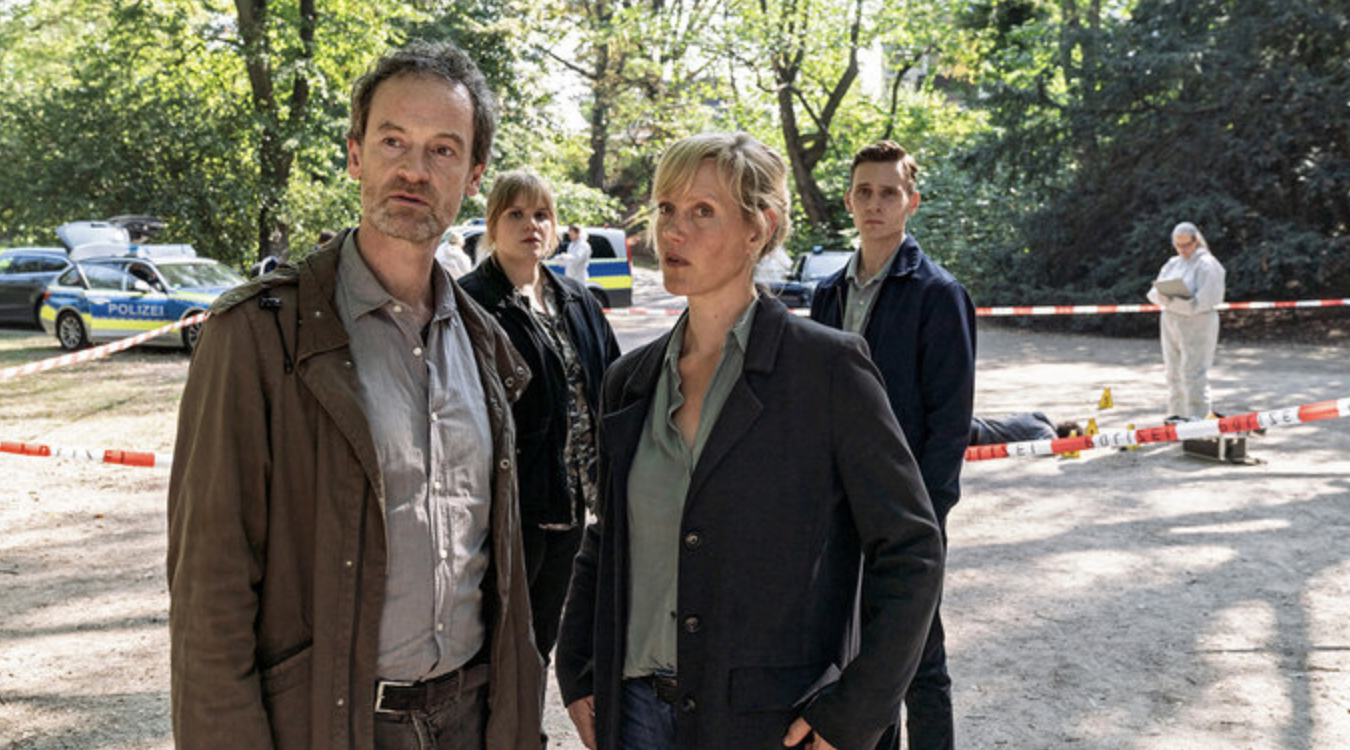 two commissioners from the police station standing at the crime scene