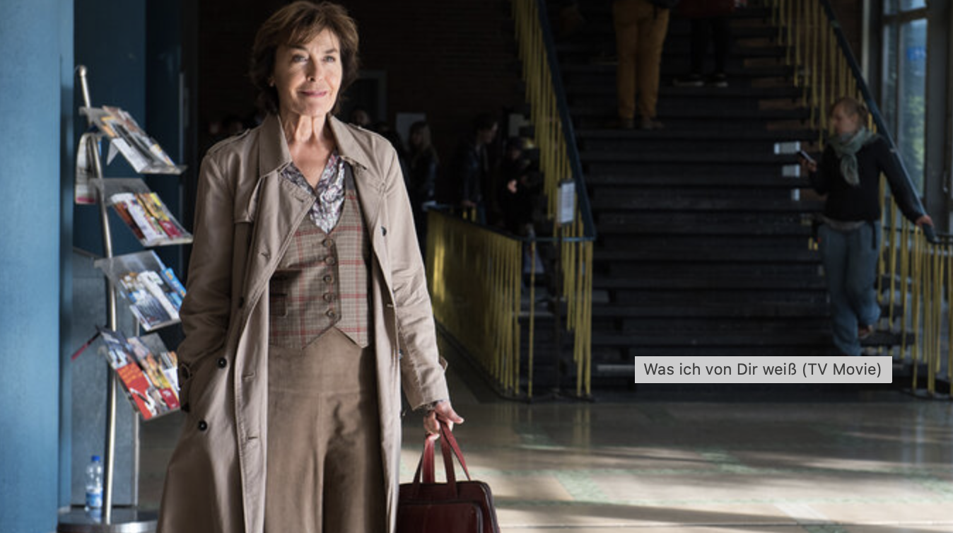 Student at senior age, she walks through the university.